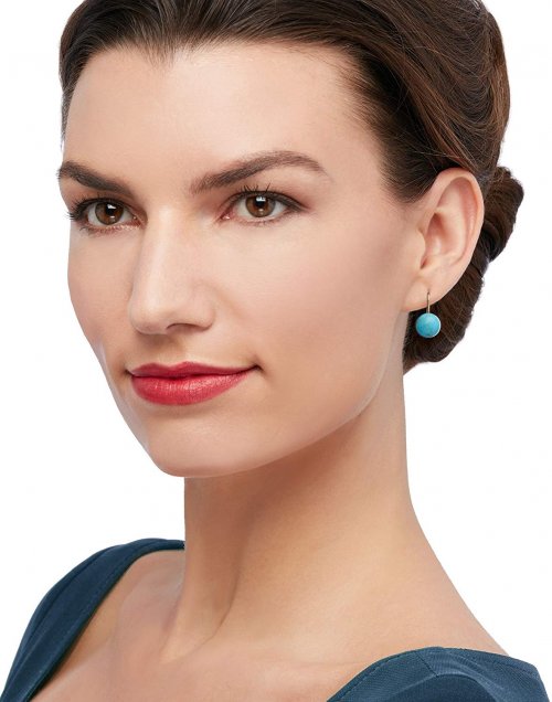 Model with turquoise earrings